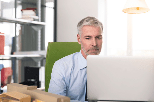 Federal employee learning about pay raises on his computer