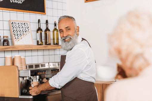 man earning income in the private sector working at a coffee shop